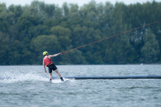 Wake boarder Riding Through Water with Dynamic Splash