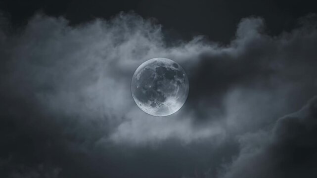 A glowing full moon shining brightly through dark dramatic clouds in the night sky during a clear evening atmosphere in nature