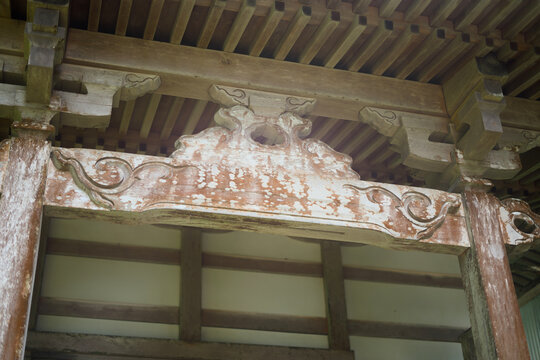 Weathered Carved Lintel Beam of Traditional Temple Entrance