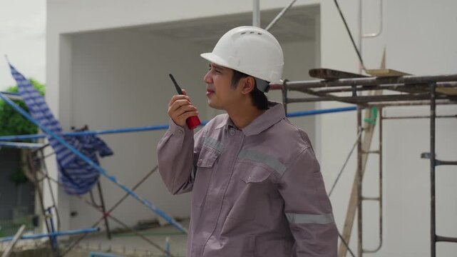 Construction inspector safety helmet walkie talkie communication site worker scaffolding building professional outdoor industry job occupation engineer architecture protective clothing structure