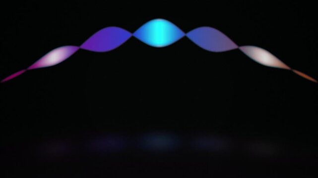 A glowing voice assistant waveform pulses in a seamless loop