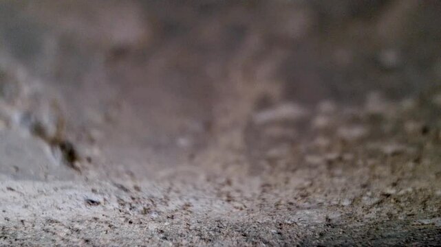 Macro view of textured grey concrete surface background detail texture wall stone cement pattern