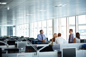 Fototapeta premium Business people, discussion and listening to ideas in meeting, financial evaluation or collaboration. Coworking, teamwork and mature colleagues with project, talking and wealth management in office