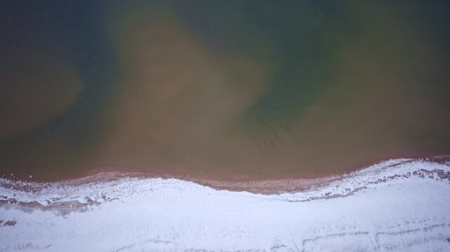 Drone shot of lake superior and coast in winter in the upper peninsula of Michigan