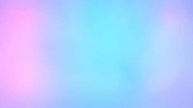 Pastel gradient background with soft pink and blue hues. Dreamy ethereal motion blur texture. Abstract colorful vaporwave aesthetic for video overlays.