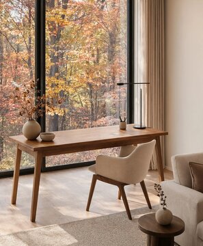 Modern home office interior with wooden desk and autumn forest view through large window
