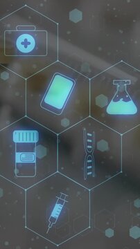 Animation of medical icons over pills