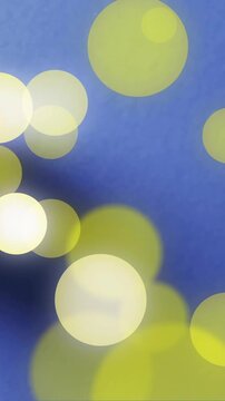 Composition of lemon and spots of light over blue background