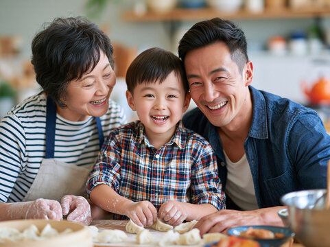 Happy Asian Family Making Traditional Dumplings Together in Kitchen