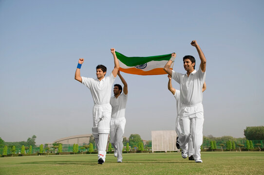 Players holding the national flag 
