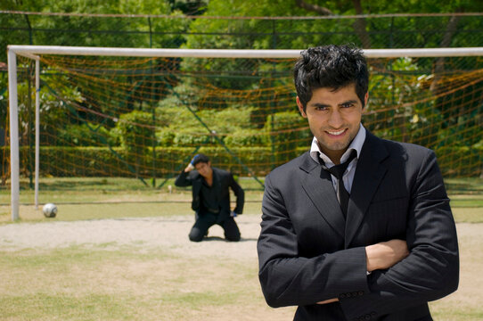 Executives in a football ground 