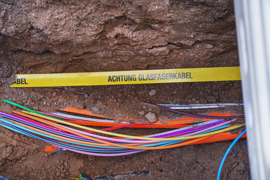 fiber optics &ndash; telecommunications cables are being laid in the ground at a construction site.