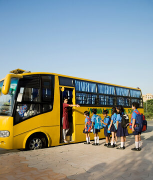 School children getting onto a school bus 