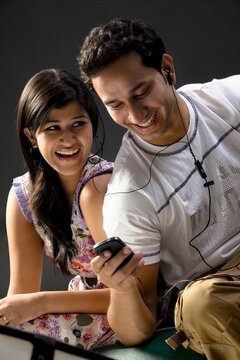 Friends looking at a mobile phone 