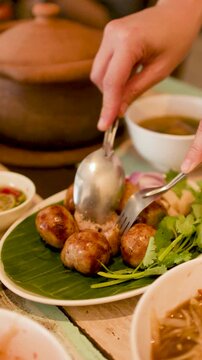 Traditional Thai Isan Fermented Pork Sausage Served on Banana Leaf