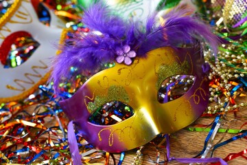 mardi gras carnival mask between confetti © Adriana