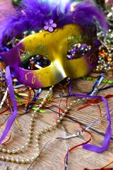 mardi gras carnival mask between confetti © Adriana