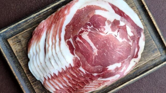 Slices of pork pancetta, ham, or bacon for a festive antipasto platter