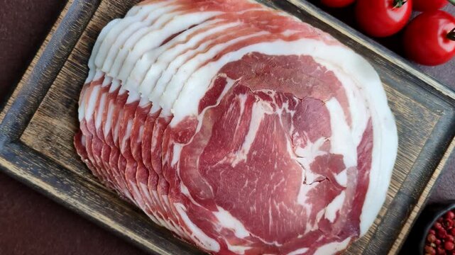 Slices of pork pancetta, ham, or bacon for a festive antipasto platter