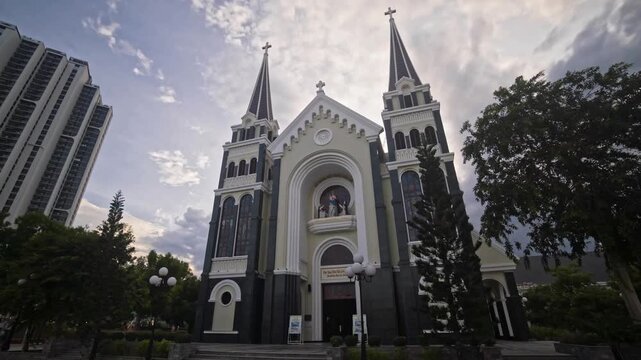Ba Lang Church (Nha Tho Giao Xu Ba Lang) in Nha Trang, Vietnam, filmed during an evening hyperlapse under cloudy skies.