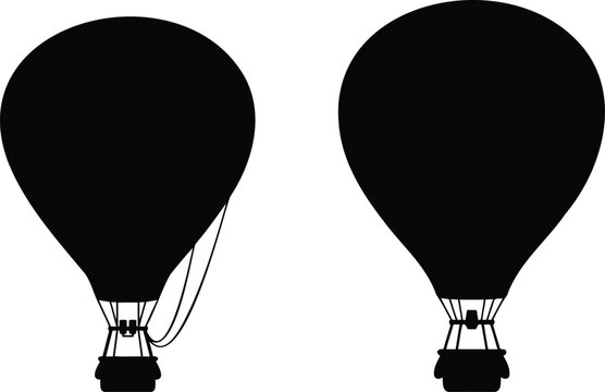 Black silhouettes of two hot air balloons flying
