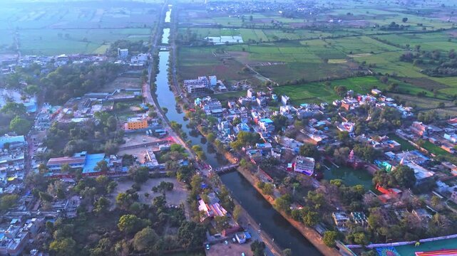 Cinematic Drone Shot of Barsana Village During Holi Festival Showing Vibrant Colorful Streets, Dense Village Homes, Ancient Architecture and Surrounding Hills