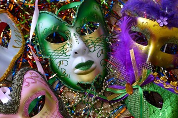 mardi gras carnival masks between confetti © Adriana