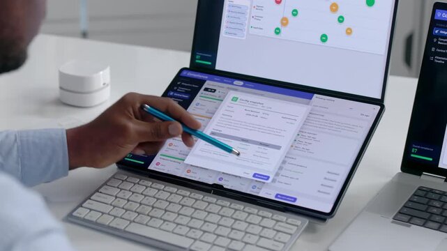 Compliance Officer Reviews Regulatory Dashboard Analytics