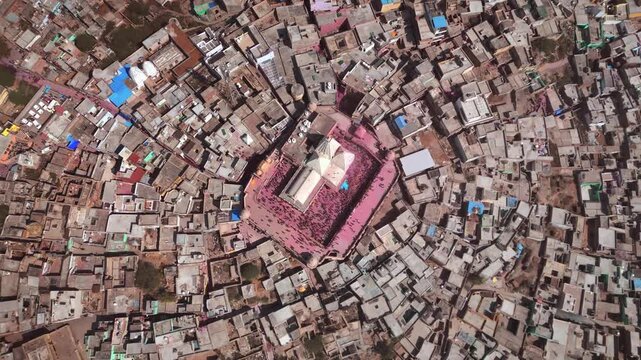 Cinematic Drone Shot of Nand Baba Temple Rising Above Nandgaon Village in Uttar Pradesh with Traditional Architecture, Historic Houses and Scenic Braj Surroundings