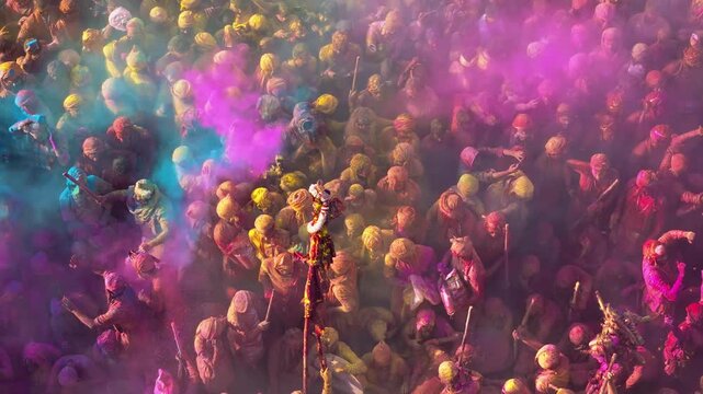 Aerial View of Holi Festival at a Sacred Indian Temple with Colorful Gulal Covering the Crowd, Traditional Religious Celebration and Vibrant Cultural Heritage
