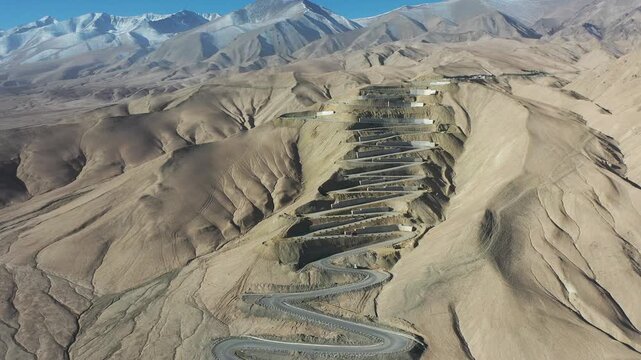 Aerial view of Panlong Ancient Road winding through mountains in Xinjiang, China