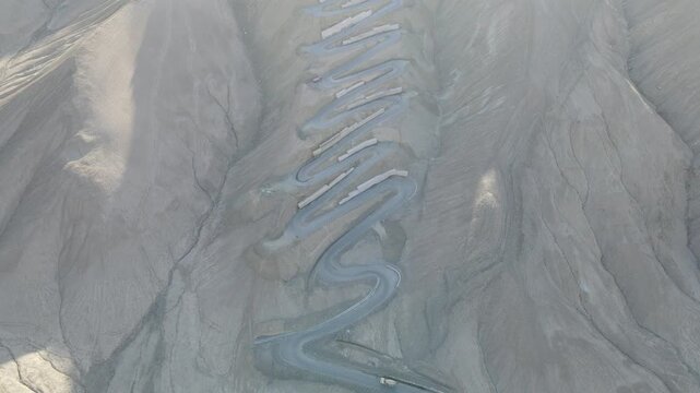 Aerial view of the winding Panlong Ancient Road in the mountains of Xinjiang, China