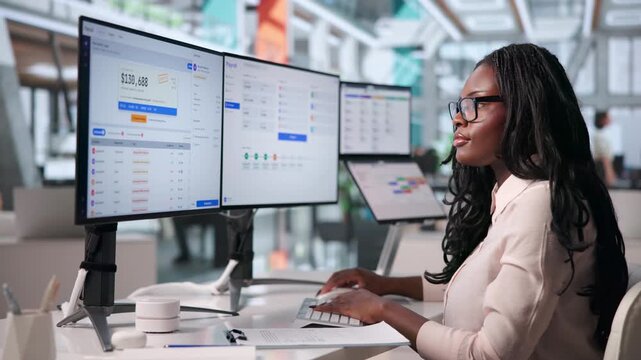 Human Resources Manager Carefully Reviews Payroll Software