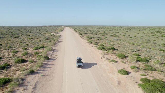 A truck adventure with a birds eye view on a sandy track, perfect for illustrating the toughness of an outdoor car