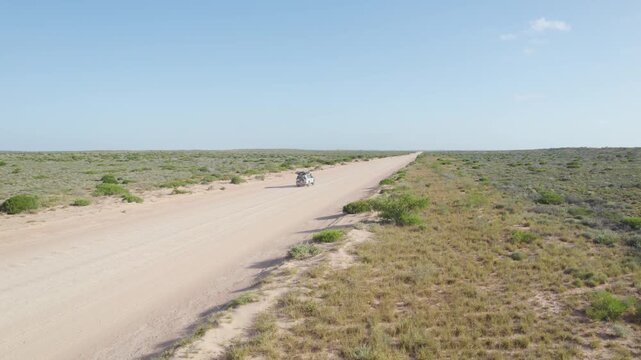 Outdoor adventure truck on sandy road track, Topdown view