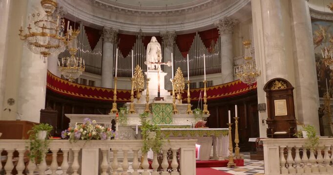 Main Altar Inside The Basilica di San Maurizio With The Statue of Saint Maurice In Porto Maurizio, Imperia, Liguria, Italy. Static Shot