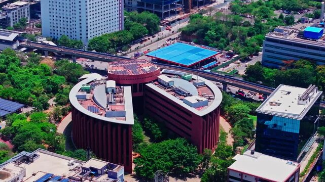 Close-up shot of tata consultancy services building with cyber crown building, metro line and IndianOil Petrol Pump at hitec city, hyderabad, telangana, india. day time, static shot, drone shot, 4k.