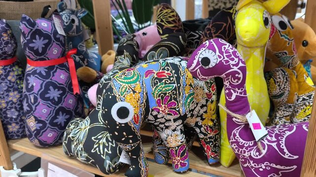 Animal toy plushies made from traditional Malaysian batik fabric. These colorful handcrafted items make ideal souvenirs and decorative displays.