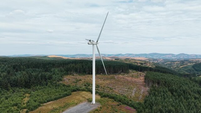 Gigantic Clocaenog Dau Wind Farm turbine - slow anti-clockwise drone rotate , North Wales, UK