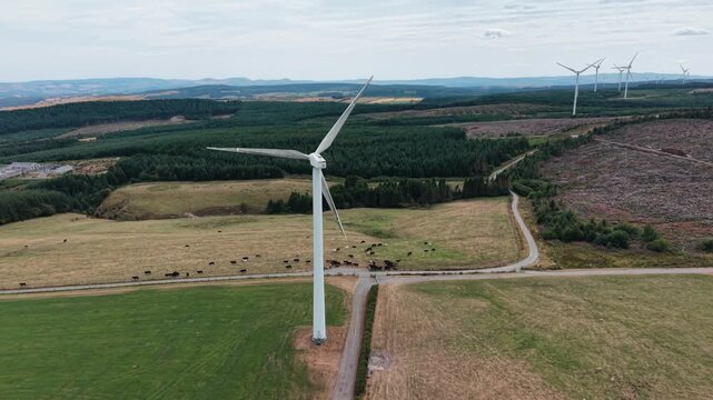 Imposing Clocaenog Dau Wind Farm turbine - anti-clockwise drone rotate, North Wales, UK