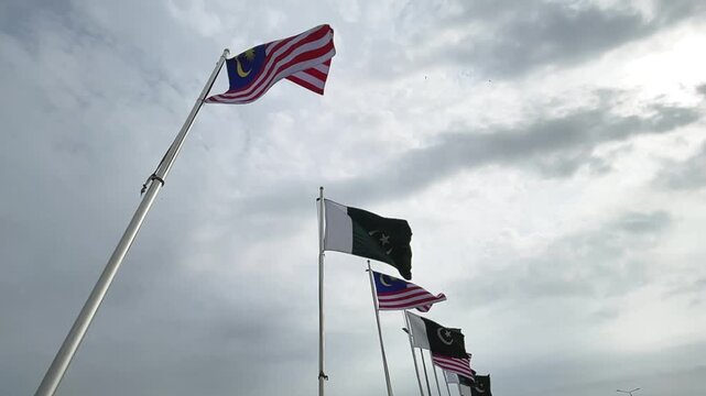 Pakistan and Malaysia Flags Waving in Slow Motion, Bilateral Relations and International Friendship Concept