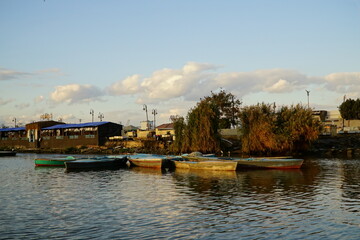 Traditional wooden fishing boats moored on Lake Timsah in Ismailia, Egypt © ahmedfawzyelaraby