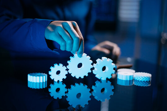 Business hands and collaboration concept with connected gears, symbolizing partnership, communication, innovation, strategy, coordination,