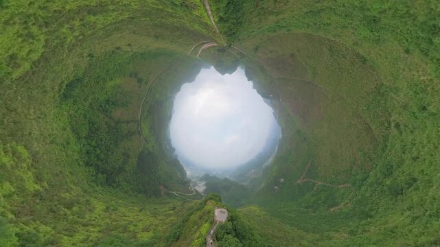 Drone view tunnel effect landscape of green mountains, footpath, Chinese style pavilion in Fengtang village, Hechi, Guangxi, China, 4k real time footage travel concept b roll shot.