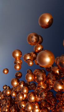 Cluster of floating copper metallic spheres on gradient blue