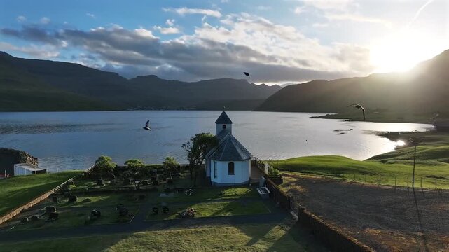 Scenic View of Nes Church and Fjord in Faroe Islands