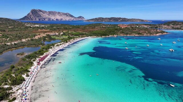 Aerial view of Cala Brandinchi beach and Capo Coda Cavallo with Tavolara island, Sardinia