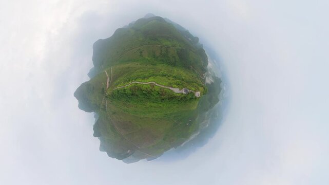 Drone view tiny planet effect landscape of green mountains, footpath, Chinese style pavilion in Fengtang village, Hechi, Guangxi, China, 4k real time footage travel concept b roll shot.