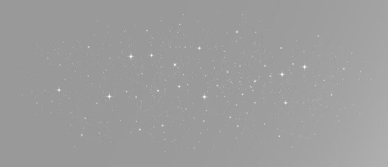 Glittering white stars and fine stardust particles floating in a wide dark space with radiant sparkles and silver cosmic dust © HolyStas