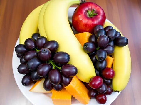 Fresh fruit platter with grapes, apples, and bananas on a white plate, ||Fruit, Bananas